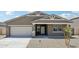 Charming single-story home with a two-car garage and a meticulously graveled front yard at 47267 W Mellen Ln, Maricopa, AZ 85139