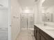 Bright bathroom featuring a glass-enclosed shower and a double sink vanity at 9120 N 174Th Ln, Waddell, AZ 85355