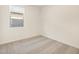 Bright, carpeted bedroom featuring a window allowing ample natural light at 9120 N 174Th Ln, Waddell, AZ 85355