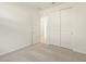 Bedroom with open door and sliding door closet at 9120 N 174Th Ln, Waddell, AZ 85355