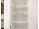 Walk-in pantry featuring three shelves for ample storage space in the kitchen at 9120 N 174Th Ln, Waddell, AZ 85355