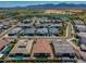 Picturesque community view surrounded by lush landscaping, lakes, and stunning mountain vistas, offering resort-style living at 11899 N Spearfish St, Surprise, AZ 85388