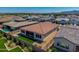 Aerial view of private backyard featuring manicured lawn, desert landscaping, privacy fence, and outdoor seating at 11899 N Spearfish St, Surprise, AZ 85388