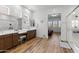 Spacious bathroom with double vanities, a walk-in shower, and a view of the bedroom, offering a luxurious retreat at 11899 N Spearfish St, Surprise, AZ 85388