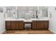 Bathroom featuring double sinks, ample counter space, and well-lit mirrors, creating a functional and stylish design at 11899 N Spearfish St, Surprise, AZ 85388