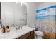 Bathroom featuring a sink, toilet, and a shower with a beach-themed shower curtain at 11899 N Spearfish St, Surprise, AZ 85388