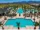 Expansive community pool area with cabanas, palm trees, lounge chairs, and well-maintained landscaping at 11899 N Spearfish St, Surprise, AZ 85388