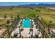 Overhead shot of community pool featuring palm trees, lounge chairs, and shaded cabanas at 11899 N Spearfish St, Surprise, AZ 85388