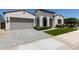 Inviting single-story home with a two-car garage, beautifully landscaped front yard, and a paved driveway at 11899 N Spearfish St, Surprise, AZ 85388