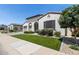 Charming home with a well-manicured lawn and beautiful landscaping, enhancing its curb appeal at 11899 N Spearfish St, Surprise, AZ 85388