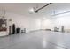 Spacious two car garage with epoxy flooring and bright lighting at 11899 N Spearfish St, Surprise, AZ 85388