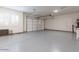 Spacious two car garage with epoxy flooring and bright lighting at 11899 N Spearfish St, Surprise, AZ 85388