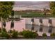 Picturesque water feature cascading into a serene lake on the meticulously landscaped golf course at 11899 N Spearfish St, Surprise, AZ 85388