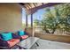 Relaxing balcony with wicker chairs and a table, offering a scenic view at 12438 N Saguaro Blvd # 126, Fountain Hills, AZ 85268