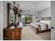Main bedroom with a king-size bed and access to a balcony at 12438 N Saguaro Blvd # 126, Fountain Hills, AZ 85268