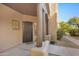 Front entrance with wood columns and a metal security door at 12438 N Saguaro Blvd # 126, Fountain Hills, AZ 85268