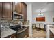 Updated kitchen with stainless steel appliances and granite countertops at 12438 N Saguaro Blvd # 126, Fountain Hills, AZ 85268