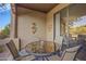 Outdoor patio with a glass-top table and four chairs at 12438 N Saguaro Blvd # 126, Fountain Hills, AZ 85268