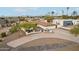 Single-story home with a large yard and driveway at 1750 E Euclid Ave, Phoenix, AZ 85042