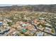 Aerial view of a house with a pool in a desert residential neighborhood at 1750 E Euclid Ave, Phoenix, AZ 85042