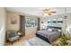 Bright bedroom with a comfortable bed and view of the backyard at 1750 E Euclid Ave, Phoenix, AZ 85042
