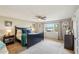Main bedroom with a dark wood frame bed and large window at 1750 E Euclid Ave, Phoenix, AZ 85042