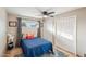 Cozy bedroom with double closet and ceiling fan at 1750 E Euclid Ave, Phoenix, AZ 85042