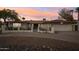 Ranch style home with landscaped yard, driveway, and gated entrance at 1750 E Euclid Ave, Phoenix, AZ 85042