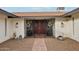 Inviting entryway with decorative gate and pathway at 1750 E Euclid Ave, Phoenix, AZ 85042