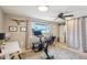 Home office space with Peloton bike and built-in desk at 1750 E Euclid Ave, Phoenix, AZ 85042