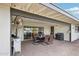 Covered patio features a dining area and built-in grill at 1750 E Euclid Ave, Phoenix, AZ 85042