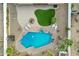An aerial view of a unique shaped pool and surrounding patio at 1750 E Euclid Ave, Phoenix, AZ 85042