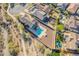 This stunning aerial view reveals a home with a sparkling pool and a meticulously landscaped backyard at 4510 N Pierce Ct, Buckeye, AZ 85396