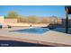 View of backyard pool and deck area, showcasing space for outdoor activities and leisure at 4510 N Pierce Ct, Buckeye, AZ 85396