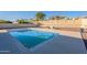 Backyard pool with rock landscaping and patio creating a tranquil outdoor living space at 4510 N Pierce Ct, Buckeye, AZ 85396