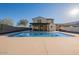 Beautiful backyard pool with a covered patio, perfect for outdoor entertaining and relaxation at 4510 N Pierce Ct, Buckeye, AZ 85396