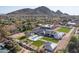 An aerial view of a luxury home featuring a pool, tennis court, and beautiful landscaping at 6215 N Casa Blanca Dr, Paradise Valley, AZ 85253