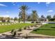 Expansive backyard featuring a pool, lush lawn, and mature trees creating a private outdoor oasis at 6215 N Casa Blanca Dr, Paradise Valley, AZ 85253