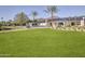 Beautiful lawn and desert landscaping with a view of the property's main home at 6215 N Casa Blanca Dr, Paradise Valley, AZ 85253