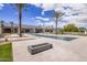 Expansive backyard with a sleek pool, spa, modern fire pit, and beautiful landscaping at 6215 N Casa Blanca Dr, Paradise Valley, AZ 85253