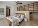 Serene bedroom showcasing custom built-ins, a ceiling fan, and stylish decor at 6215 N Casa Blanca Dr, Paradise Valley, AZ 85253