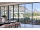Bright dining room with floor-to-ceiling windows and view of the landscape at 6215 N Casa Blanca Dr, Paradise Valley, AZ 85253