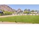 Expansive lawn with mountain views featuring manicured landscaping and clear blue skies at 6215 N Casa Blanca Dr, Paradise Valley, AZ 85253