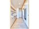 Modern kitchen pantry area featuring white cabinets, open shelves, and stainless steel appliances at 6215 N Casa Blanca Dr, Paradise Valley, AZ 85253