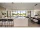 Open-concept kitchen features modern appliances, marble countertops, and a spacious island with seating at 6215 N Casa Blanca Dr, Paradise Valley, AZ 85253
