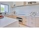 Well-equipped kitchen with stainless steel oven, sleek countertops, custom cabinets, and modern appliances at 6215 N Casa Blanca Dr, Paradise Valley, AZ 85253