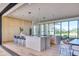 Spacious kitchen with large island, modern design, and sliding doors at 6215 N Casa Blanca Dr, Paradise Valley, AZ 85253