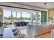 Open kitchen and dining area with an island, high-end appliances, and access to outdoor space at 6215 N Casa Blanca Dr, Paradise Valley, AZ 85253
