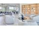 Cozy living room with a modern design, comfortable seating, and stylish built-in shelving at 6215 N Casa Blanca Dr, Paradise Valley, AZ 85253