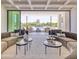 Sophisticated living room with plush sofas, stylish coffee tables, and a view of the pool at 6215 N Casa Blanca Dr, Paradise Valley, AZ 85253
